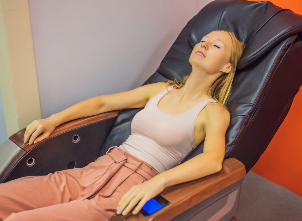 Woman relaxing in a massage chair