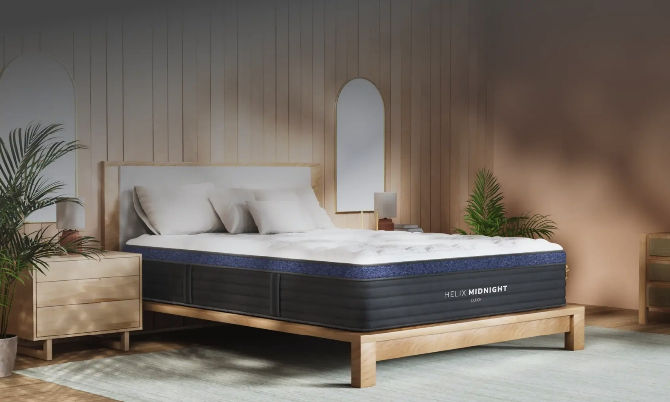 Picture of a white and gray mattress on a minimalist wooden bedframe